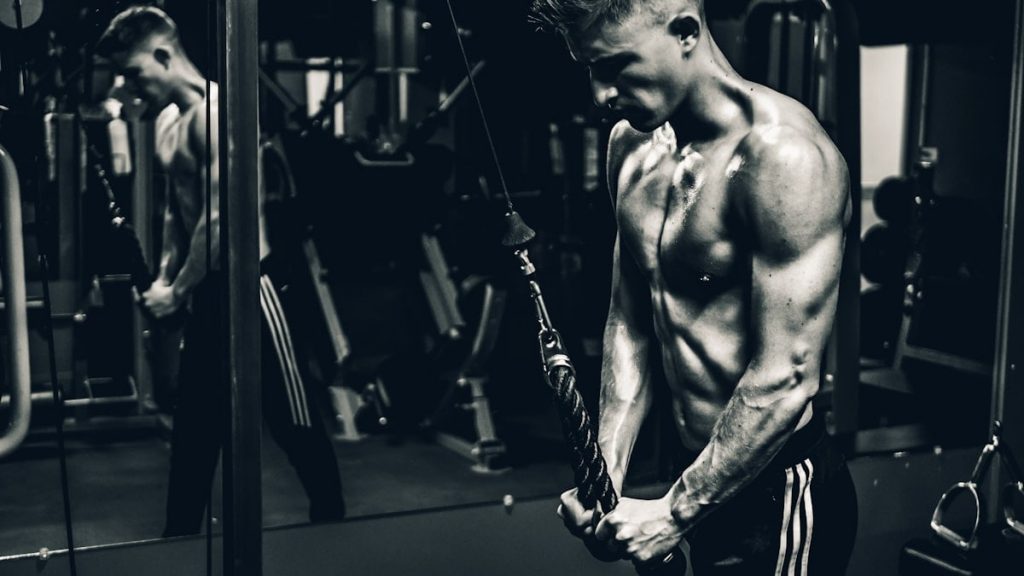 grayscale photo of man exercising